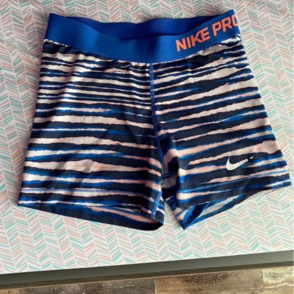 Blue, pink, and white striped nike pro shorts size medium